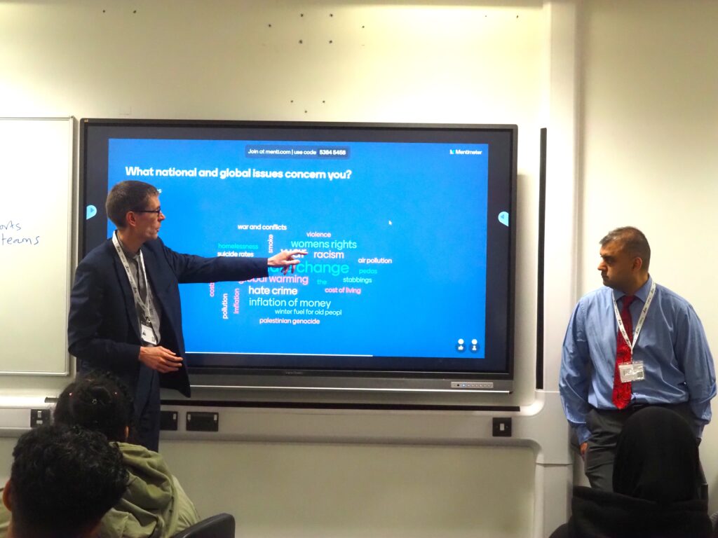 Riaz and Tom, from the St Philips Centre, speaking to a group of WQE students